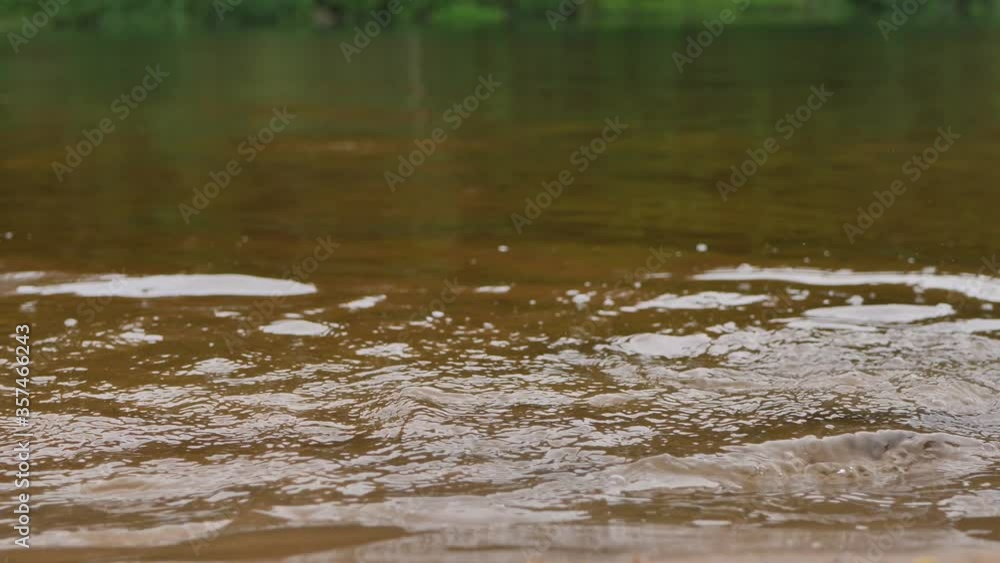 The child runs on the water of the river The child runs on the water of the river