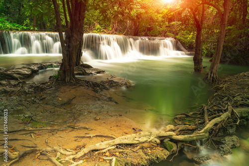 Beautiful waterfalls in the sun in the forest  Erawan National Park  Thailand  natural scenery