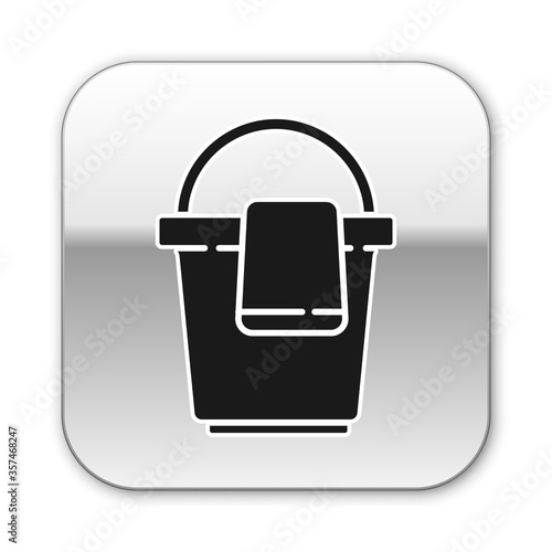 Black Bucket with rag icon isolated on white background. Cleaning service concept. Silver square button. Vector Illustration