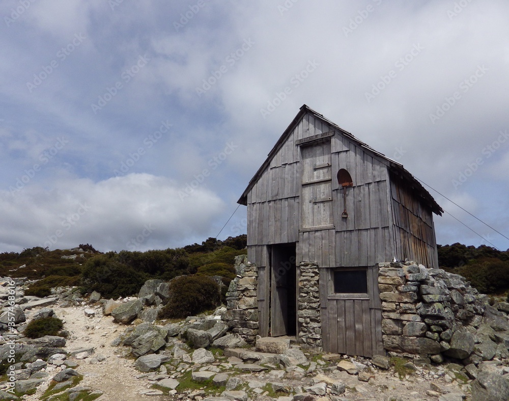 Kitchen hut, wooden hut has double story shelter and one shovel in front of the hut . one of most famous overland track in AUSTRALIA TASMANIA Kitchen hut, wooden hut has double story shelter and one shovel in front of the hut . one of most famous overland track in AUSTRALIA TASMANIA