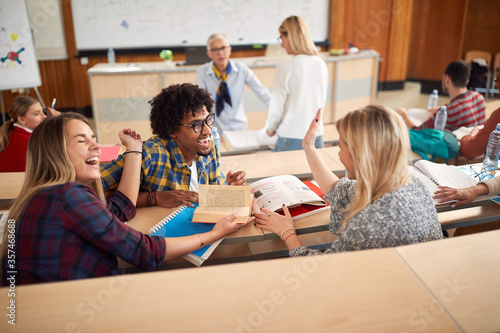 Students laughing while having lecture