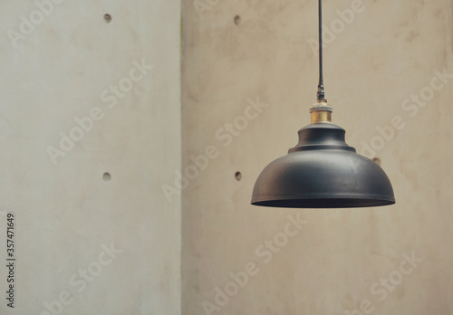 Black minimalist lamp cap, with white cement wall as background in minimalist concept. Industrial concept stock photos. Minimalist interior. industrial home applicant.