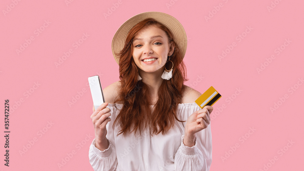 Cheerful Girl Holding Smartphone And Credit Card, Panorama, Studio Shot Cheerful Girl Holding Smartphone And Credit Card, Panorama, Studio Shot