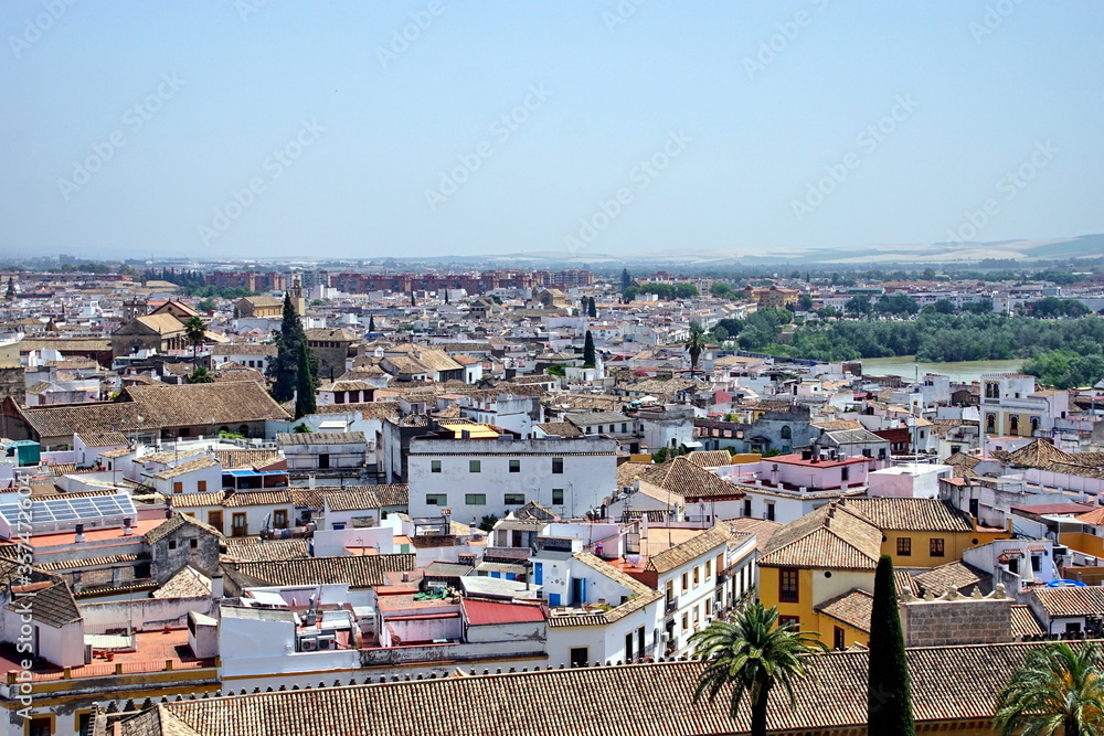 Bright morning over historical cityscape of Cordoba with houses and tile roofs, Spain.