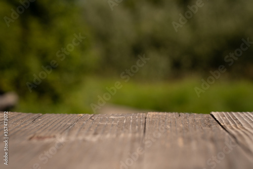 old wooden table with green background