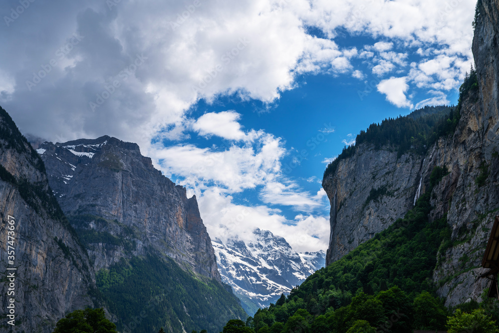 View of Lauterbrunnen valley, the Staubbachfall, and the Lauterbrunnen Wall in Swiss Alps, Switzerland.