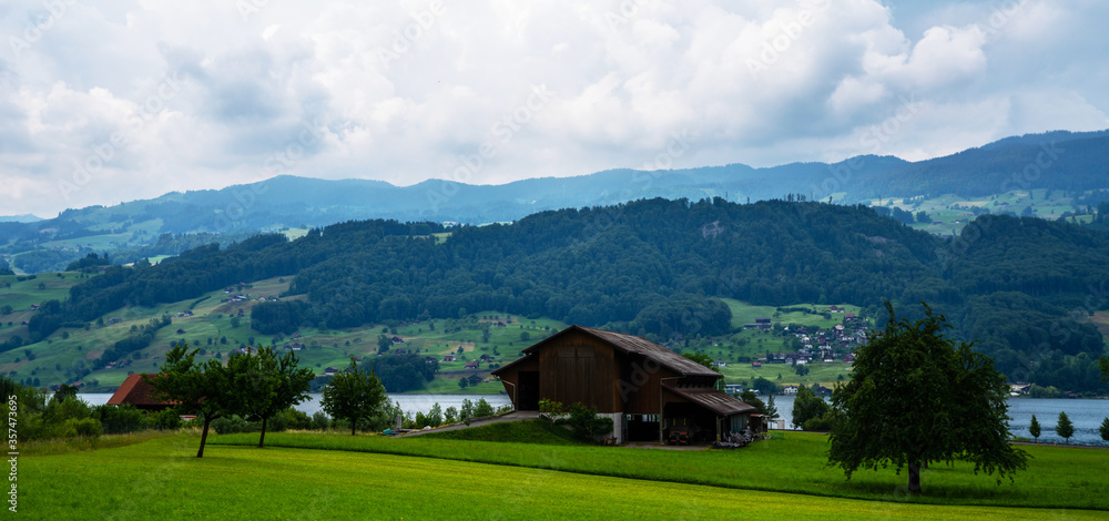 Idyllic rural view of farmland in the beautiful surroundings near Basel, Switzerland, Europe, close to the France and German borders. Fields and wonderful blue sky, panoramic view with shadows. Idyllic rural view of farmland in the beautiful surroundings near Basel, Switzerland, Europe, close to the France and German borders. Fields and wonderful blue sky, panoramic view with shadows.