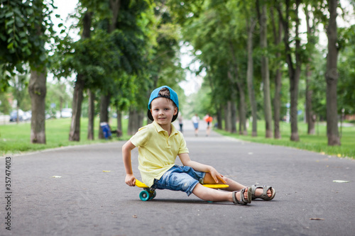 Little boy on skate board. © Natalia Sevriukova