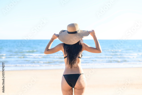 Portrait of young woman in a bikini at the beach