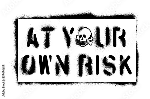   At Your Own Risk   warning message and skull. Spray graffiti stencil. White background.