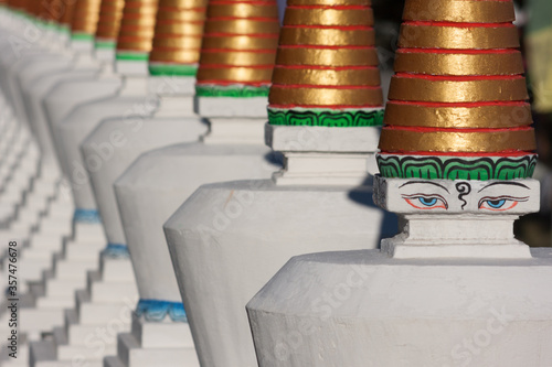 Buddhist stupas painted in white and Buddha eyes.