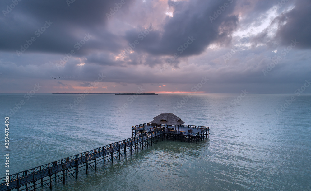 Jetty bar of the coast of Tanzania with a storm rolling in