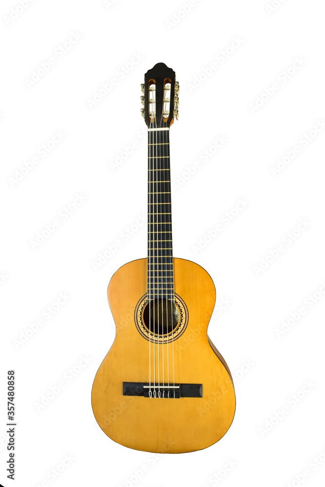 Brown acoustic wooden guitar stands vertically on a white background