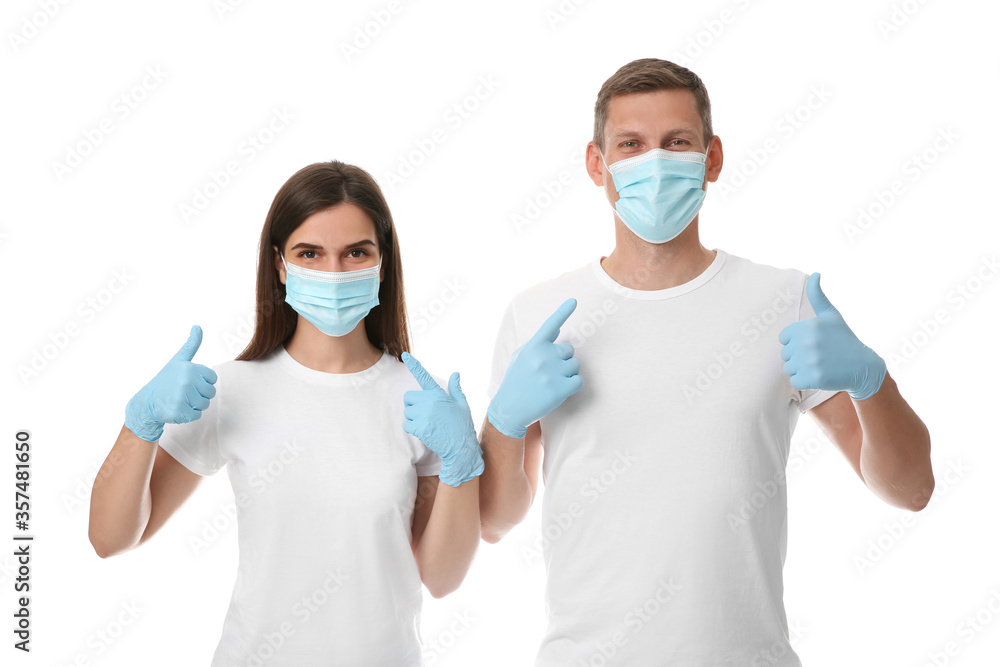 Volunteers in masks and gloves on white background. Protective measures during coronavirus quarantine