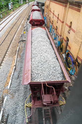 Cargo train with aggregate stones, view from above