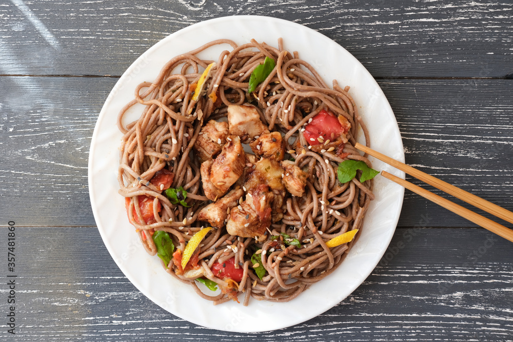 Japanese buckwheat noodle soba with vegetables, chicken meat and soy