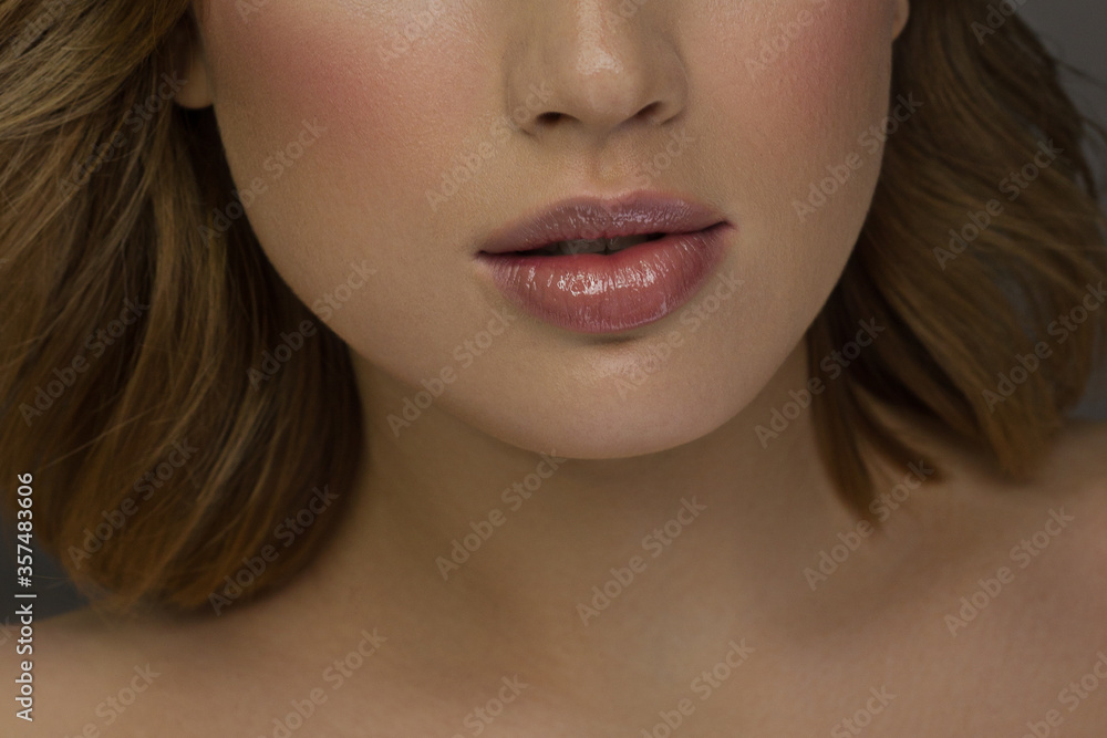 Smiling young girl. Beauty face closeup. Sexy lips. Beauty natural lip makeup detail. Beautiful make-up close-up. Sensual open mouth with teeth. Lipstick and lipgloss Smiling young girl. Beauty face closeup. Sexy lips. Beauty natural lip makeup detail. Beautiful make-up close-up. Sensual open mouth with teeth. Lipstick and lipgloss