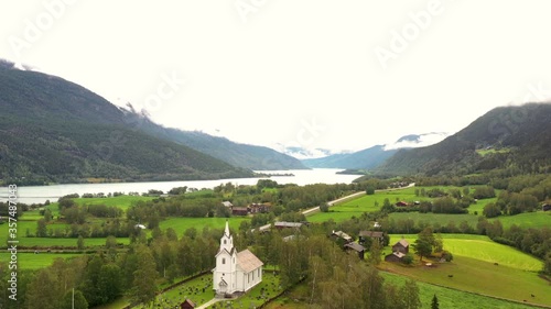 Aerial view Norwegian town with the church in valleys, plains, fjords, valleys, plains, hills and mountains in Norway.