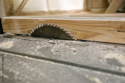 Circular saw. Metal toothed disc. Joiners tool for cutting wood. Close-up.