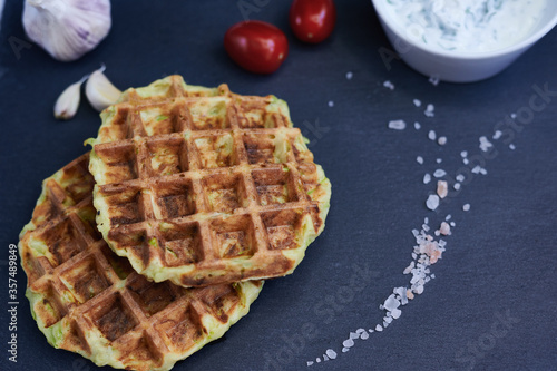courgette waffles close up on a stone background with Himalayan salt 