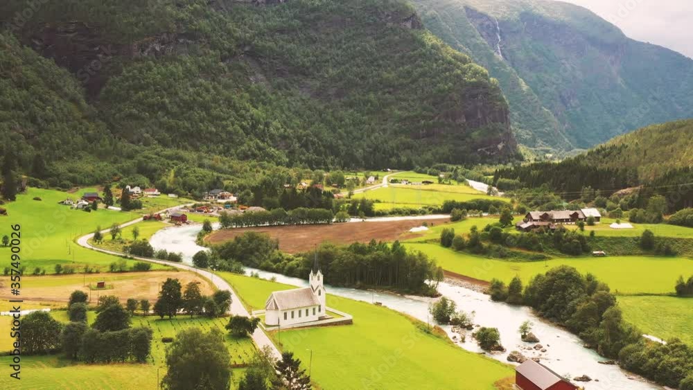 Aerial view Norwegian town with the church in valleys, plains, fjords, valleys, plains, hills and mountains in Norway. Aerial view Norwegian town with the church in valleys, plains, fjords, valleys, plains, hills and mountains in Norway.