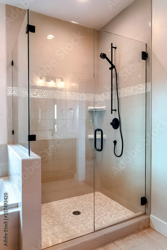 Принти на полотні Shower stall with half glass enclosure and black shower head and handle