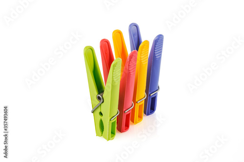 Color plastic clothespins isolated on white background. Plastic clips. Close-up. Full depth of field.