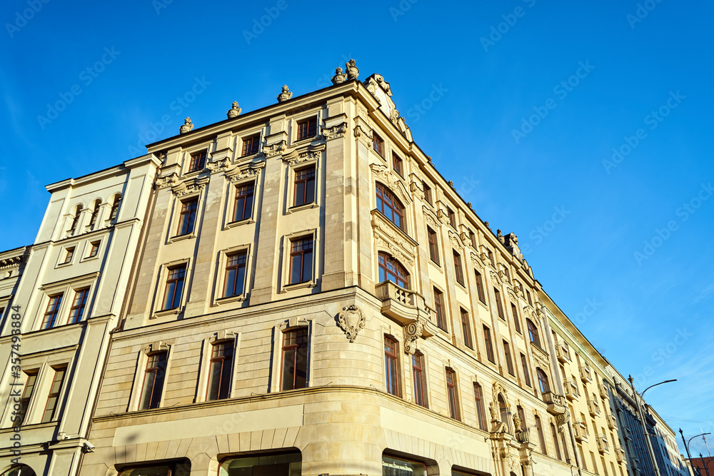 Facades with balconies of historic tenement houses in the city of Poznan..