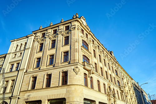 Facades with balconies of historic tenement houses in the city of Poznan..