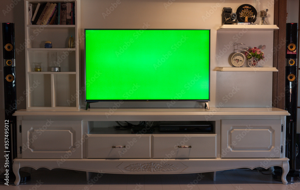 Big green screen led TV in a cozy living room. Modern 55 inch sized