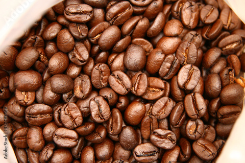 Brown tasty roasted coffee beans background © Guimarães