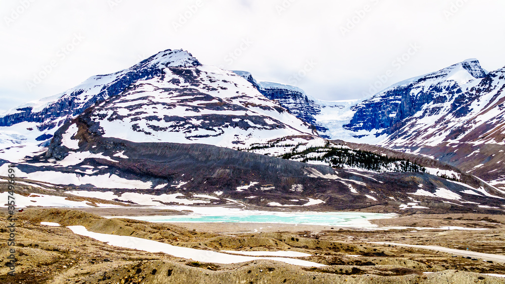 A turquoise Glacial Lake at the bottom of the Athabasca Glacier in the Columbia Icefields in Jasper National Park, Alberta, Canada