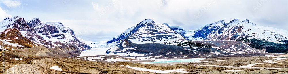 Panorama View of the Columbia Icefields in Jasper National Park, Alberta, Canada at spring time. The famous Athabasca Glacier on the left