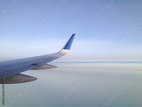 Jetplane Wing over Smooth Clouds