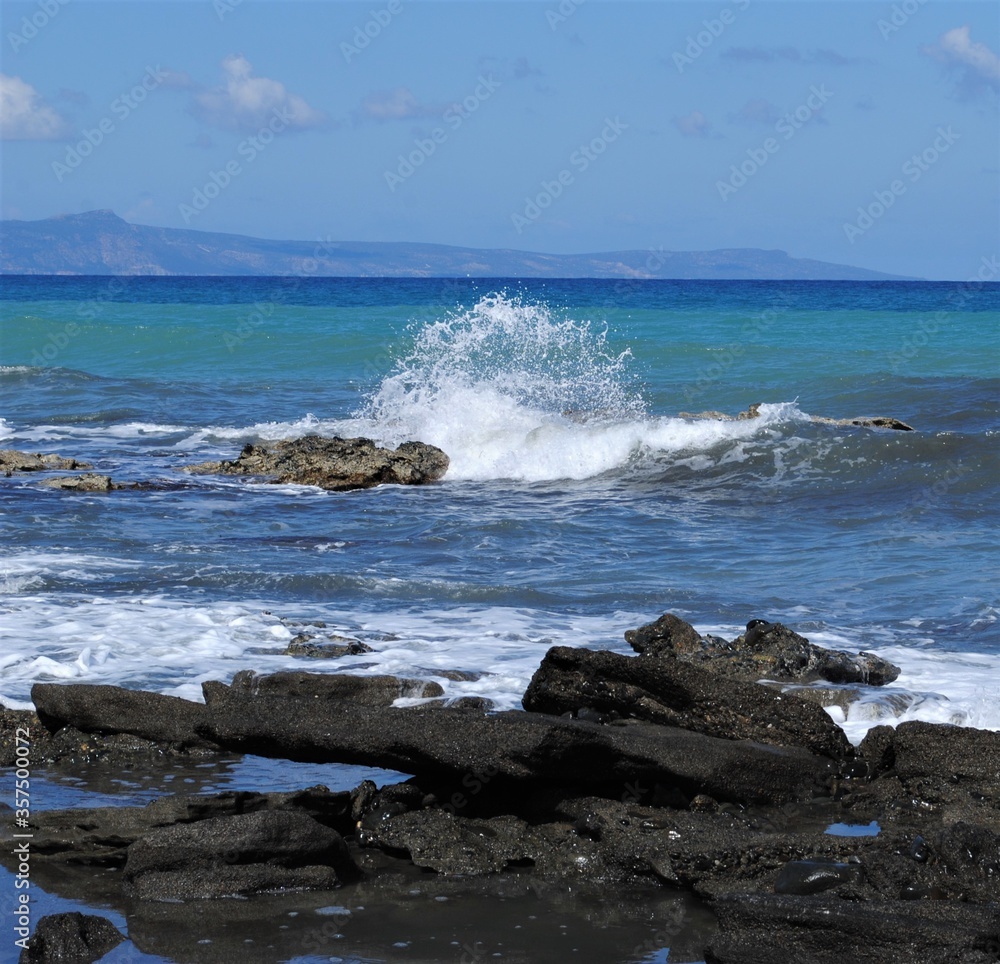 Waves break on rocks Waves break on rocks