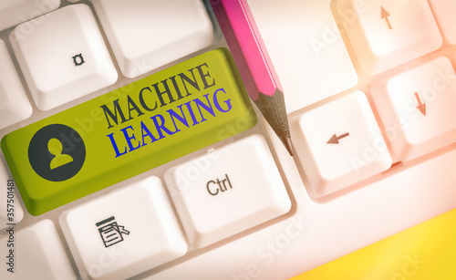 Writing note showing Machine Learning. Business concept for the concept that a computer can learn new data itself photo