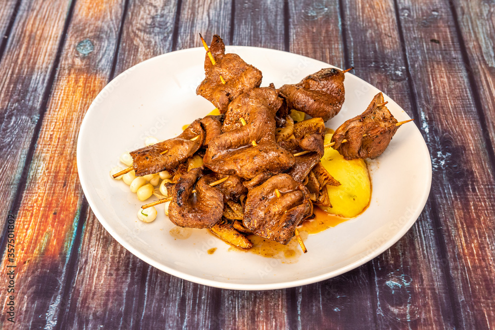 Delicious plate of Peruvian-style anticuchos Delicious plate of Peruvian-style anticuchos