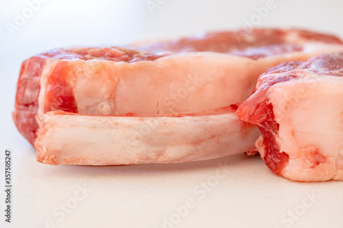 Closeup of Wild Boar Steaks on White Backgound or Quartz Countertop