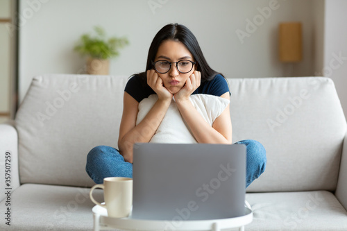 Unemployed Freelancer Girl At Laptop Sitting Having No Work Indoors photo