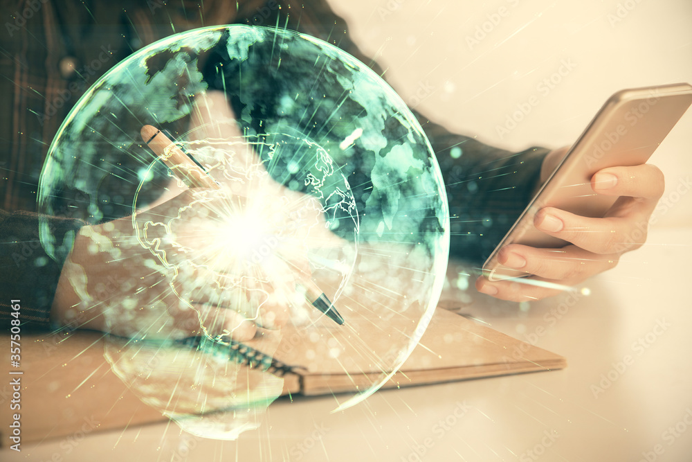 Double exposure of business theme sketch hologram and woman holding and using a mobile device. Double exposure of business theme sketch hologram and woman holding and using a mobile device.