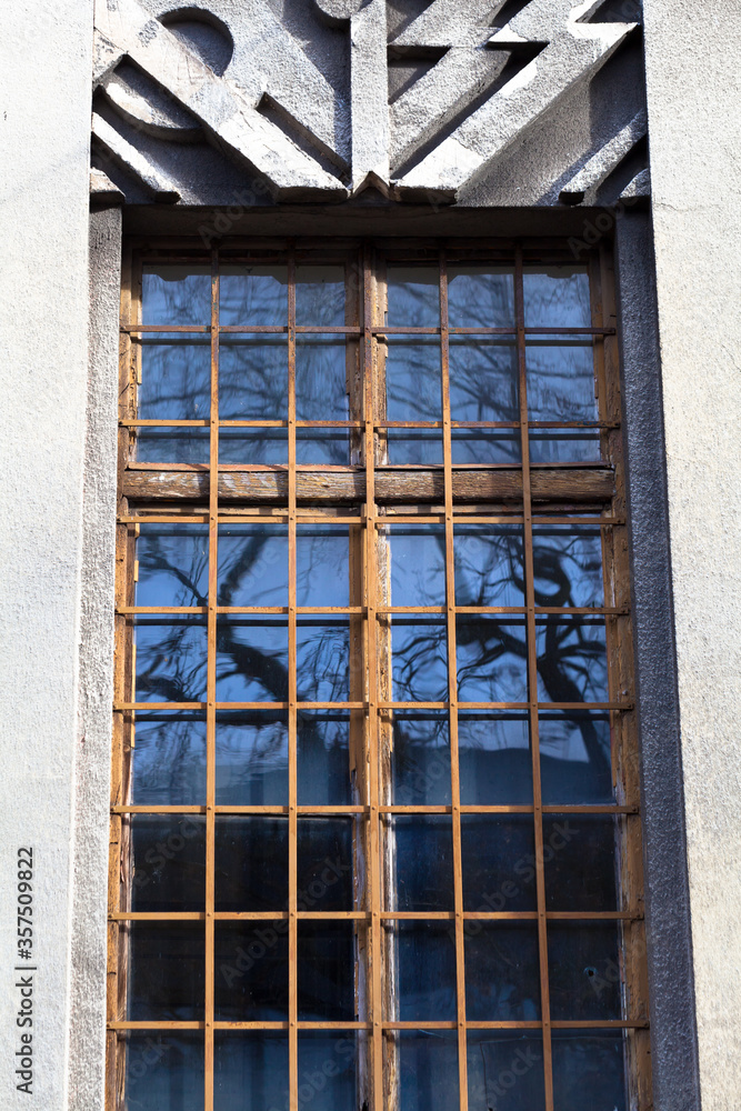 Fototapeta premium Cracow, Poland, Art-Noveau sculpted window in a abandoned old building.