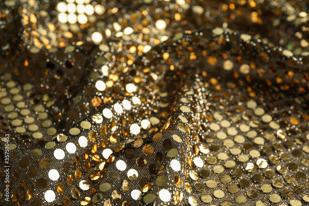 Texture of beautiful golden fabric with paillettes as background, closeup Texture of beautiful golden fabric with paillettes as background, closeup
