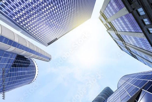 Office buildings with tinted windows, low angle view. Modern architectural corporation