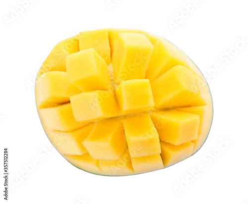 Half of ripe mango cut into cubes isolated on white, top view
