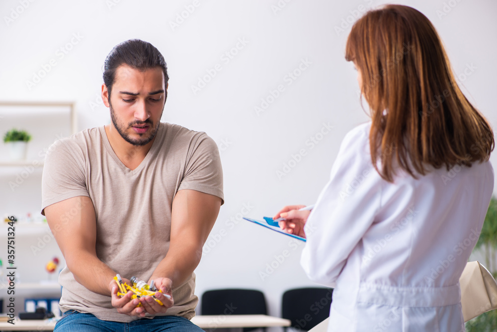 Male diabetic patient visiting young female doctor