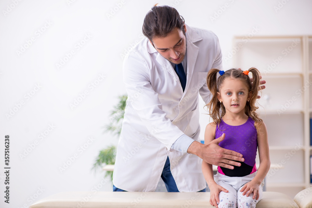 Small girl visiting young male doctor Small girl visiting young male doctor