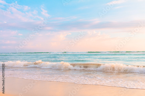 Soft ocean wave, blue water and beautiful cloudy sky. © Oleandra9