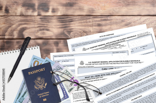Department of State form DS82 U.S. Passport renewal application for eligible individuals lies on table and ready to fill. Paperwork during operations with US Passport concept photo