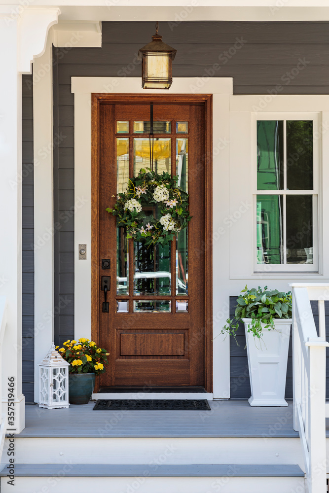 Fototapeta premium brown front door with flowers
