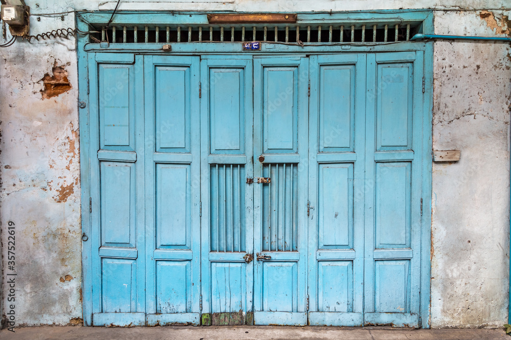 old wooden blue door in old building old wooden blue door in old building